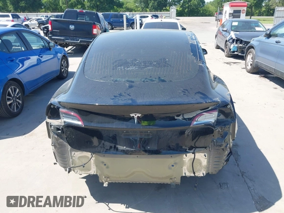 2018 Tesla Model 3 Long Range Battery with VIN 5YJ3E1EA7JF098632, listed as a IAAI auction lot 42002181 with 73,371 mi miles and . Bid and sale history available at DreamBid. Image 17.