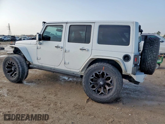 2015 Jeep Wrangler Unlimited Sport with VIN 1C4BJWDG9FL759012, listed as a Copart auction lot 61002465 with 101,395 mi miles and Salvage title. Bid and sale history available at DreamBid. Image 2.
