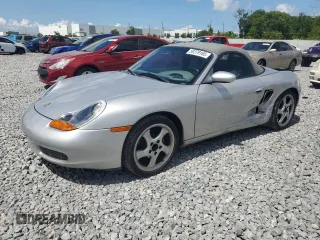 1999 Porsche Boxster z VIN WP0CA2980XU633261, wystawiony jako Copart lot #59379165 z przebiegiem 167 654 mil mil oraz Szkoda całkowita • Salvage title. Historia ofert i sprzedaży dostępna na DreamBid. Obrazek 1.