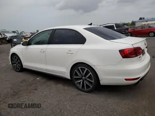 2014 Volkswagen Jetta GLI with VIN 3VW4T7AJ4EM384679, listed as a Copart auction lot 64014195 with 137,793 mi miles and Clean title. Bid and sale history available at DreamBid. Image 2.