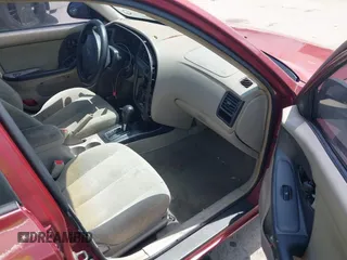 2002 Hyundai Elantra GLS z VIN KMHDN45D22U338304, wystawiony jako IAAI lot #42479874 z przebiegiem 174 441 mil mil oraz . Historia ofert i sprzedaży dostępna na DreamBid. Obrazek 5.