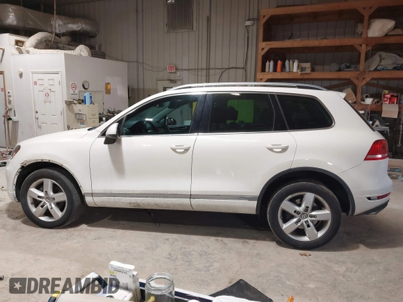 2011 Volkswagen Touareg Sport with VIN WVGFF9BP8BD004747, listed as a IAAI auction lot 41780515 with 159,228 mi miles and . Bid and sale history available at DreamBid. Image 14.