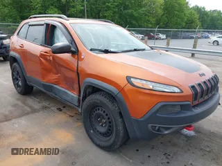 2015 Jeep Cherokee Trailhawk z VIN 1C4PJMBS8FW578208, wystawiony jako IAAI lot #42097446 z przebiegiem 242 413 mil mil oraz . Historia ofert i sprzedaży dostępna na DreamBid. Obrazek 1.