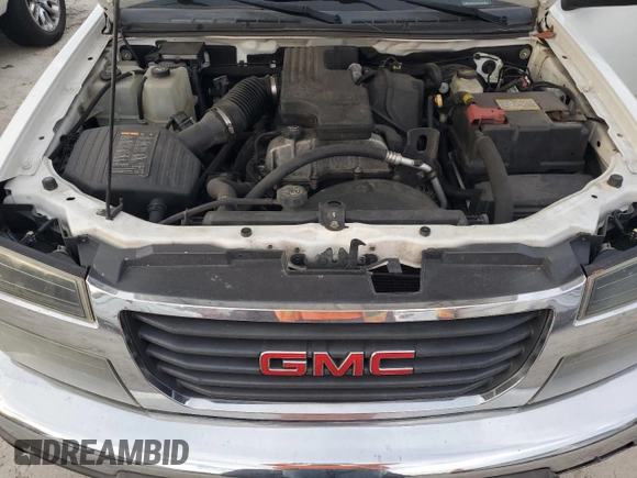 2010 GMC Canyon z VIN 1GTCSBD90A8149782, wystawiony jako Copart lot #74656504 z przebiegiem 242 911 mil mil oraz Szkoda całkowita • Salvage title. Historia ofert i sprzedaży dostępna na DreamBid. Obrazek 11.