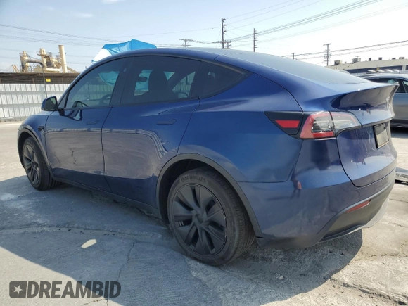2024 Tesla Model Y with VIN 7SAYGDED0RF102479, listed as a Copart auction lot 55431975 with 23,989 mi miles and Salvage title. Bid and sale history available at DreamBid. Image 2.