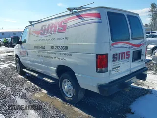 2014 Ford Econoline Cargo Commercial with VIN 1FTNE2EW3EDA18900, listed as a IAAI auction lot 41209002 with 138,014 mi miles. Bid and sale history available at carsss.com. Image 3.