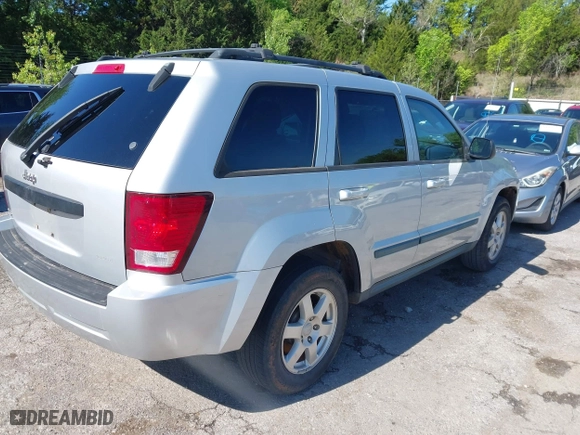 2009 Jeep Grand Cherokee Laredo with VIN 1J8GS48K99C528145, listed as a IAAI auction lot 42077024 with 167,588 mi miles. Bid and sale history available at carsss.com. Image 4.