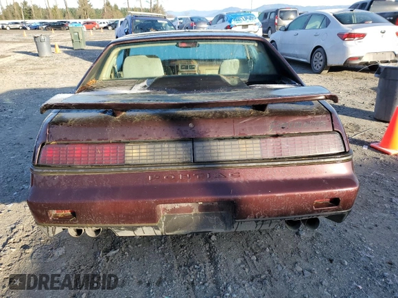 1986 Pontiac Fiero z VIN 1G2PF3793GP210763, wystawiony jako Copart lot #41891075 z przebiegiem 144 219 mil mil oraz Czysty tytuł • Clean title. Historia ofert i sprzedaży dostępna na DreamBid. Obrazek 6.
