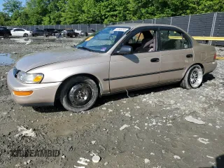 1995 Toyota Corolla DX with VIN 2T1AE09B0SC098739, listed as a Copart auction lot 57653205 with 154,226 mi miles and Salvage title. Bid and sale history available at DreamBid. Image 1.