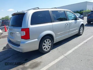 2012 Chrysler Town & Country Touring L with VIN 2C4RC1CG1CR245008, listed as a IAAI auction lot 41951680 with 98,656 mi miles and . Bid and sale history available at DreamBid. Image 4.