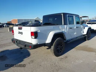 2023 Jeep Gladiator Willys z VIN 1C6HJTAGXPL528674, wystawiony jako IAAI lot #41376339 z przebiegiem 7 102 mil mil oraz . Historia ofert i sprzedaży dostępna na DreamBid. Obrazek 4.