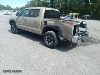 2020 Toyota Tacoma 4WD SR5 with VIN 3TMCZ5AN2LM356140, listed as a IAAI auction lot 41751425 with 80,671 mi miles. Bid and sale history available at carsss.com. Image 3.
