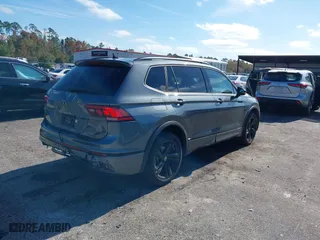 2023 Volkswagen Tiguan SE R-Line Black with VIN 3VVCB7AX7PM132001, listed as a IAAI auction lot 41042085 with 15,007 mi miles. Bid and sale history available at carsss.com. Image 4.