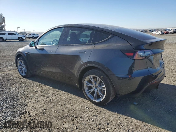 2024 Tesla Model Y with VIN 7SAYGDED4RF017614, listed as a Copart auction lot 88494625 with 11,209 mi miles and Salvage title. Bid and sale history available at DreamBid. Image 2.