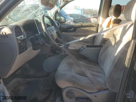 2003 GMC Envoy SLE with VIN 1GKDS13S732336708, listed as a Copart auction lot 88040595 with 354,751 mi miles and Salvage Title. Bid and sale history available at carsss.com. Image 7.