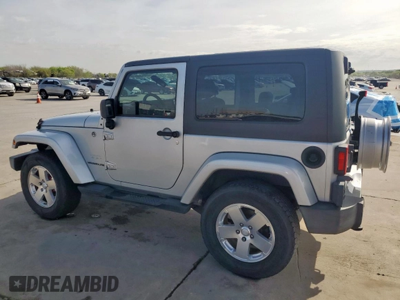 2009 Jeep Wrangler Sahara z VIN 1J4FA54169L780809, wystawiony jako Copart lot #50598925 z przebiegiem 121 078 mil mil oraz Szkoda całkowita • Salvage title. Historia ofert i sprzedaży dostępna na DreamBid. Obrazek 2.