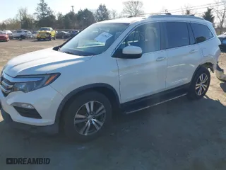 2016 Honda Pilot EX-L with VIN 5FNYF6H52GB029080, listed as a IAAI auction lot 41875412 with 127,697 mi miles. Bid and sale history available at carsss.com. Image 2.