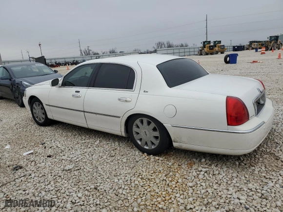 2003 Lincoln Town Car Cartier with VIN 1LNHM83W23Y627418, listed as a Copart auction lot 43817895 with 141,414 mi miles and Salvage Title. Bid and sale history available at carsss.com. Image 2.