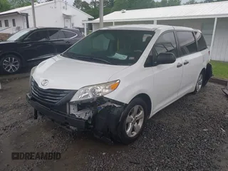 2014 Toyota Sienna L with VIN 5TDZK3DC9ES473780, listed as a IAAI auction lot 42245274 with 203,060 mi miles and . Bid and sale history available at DreamBid. Image 2.