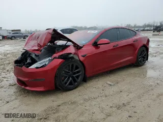 2024 Tesla Model S with VIN 5YJSA1E52RF537354, listed as a Copart auction lot 43077365 with 8934 miles and Salvage Title. Bid and sale history available at carsss.com. Image 1.