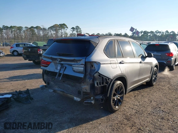 2016 BMW X5 xDrive40e with VIN 5UXKT0C57G0S75476, listed as a IAAI auction lot 41642249 with 105,489 mi miles and . Bid and sale history available at DreamBid. Image 4.