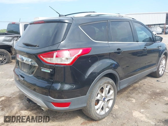 2014 Ford Escape Titanium with VIN 1FMCU0JX1EUD71953, listed as a IAAI auction lot 42036023 with 165,624 mi miles. Bid and sale history available at carsss.com. Image 4.