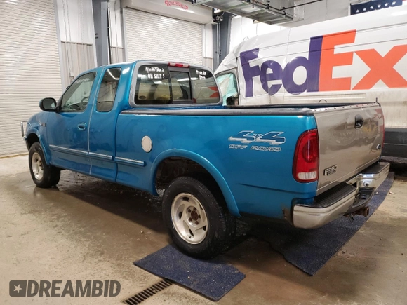 1997 Ford F-150 XL with VIN 1FTDX186XVKC03985, listed as a Copart auction lot 52808035 with 274,590 mi miles and Clean title. Bid and sale history available at DreamBid. Image 2.