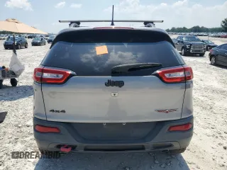 2015 Jeep Cherokee Trailhawk with VIN 1C4PJMBS3FW735398, listed as a Copart auction lot 63700015 with 157,123 mi miles and Clean title. Bid and sale history available at DreamBid. Image 6.