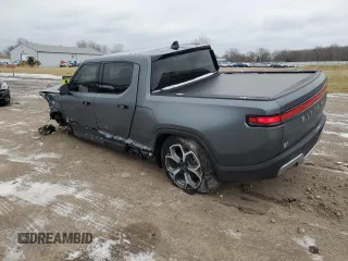 2024 Rivian R1T Adventure with VIN 7FCTGBAA8RN034399, listed as a Copart auction lot 86857044 with 8,176 mi miles and Salvage Title. Bid and sale history available at carsss.com. Image 2.