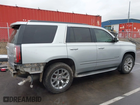 2015 GMC Yukon SLT with VIN 1GKS2BKCXFR131919, listed as a IAAI auction lot 41664827 with 149,398 mi miles. Bid and sale history available at carsss.com. Image 14.