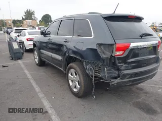 2013 Jeep Grand Cherokee Laredo with VIN 1C4RJEAGXDC620968, listed as a IAAI auction lot 41425270 with 127,739 mi miles. Bid and sale history available at carsss.com. Image 3.