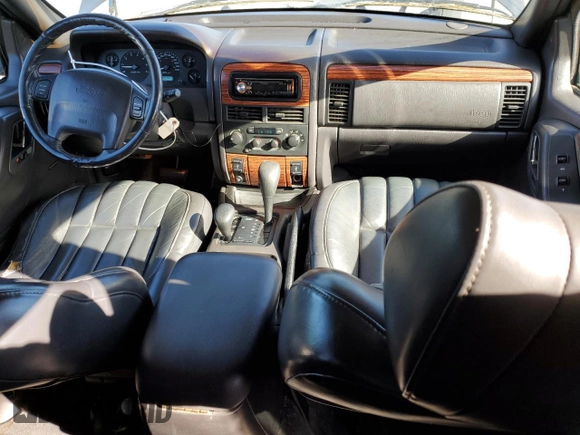 1999 Jeep Grand Cherokee Limited with VIN 1J4GW68N9XC743436, listed as a Copart auction lot 86803524 with 129,204 mi miles and Clean Title. Bid and sale history available at carsss.com. Image 8.