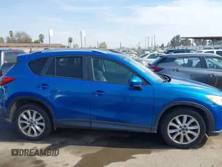 2014 Mazda CX-5 Grand Touring with VIN JM3KE4DY1E0327703, listed as a IAAI auction lot 41755735 with 206,845 mi miles. Bid and sale history available at carsss.com. Image 13.
