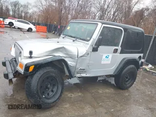 2006 Jeep Wrangler Sport Right Hand Drive with VIN 1J4F449SX6P764491, listed as a IAAI auction lot 41709726 with 290,798 mi miles. Bid and sale history available at carsss.com. Image 14.