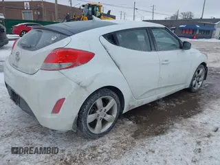 2013 Hyundai Veloster w/Black Int with VIN KMHTC6AD9DU171722, listed as a IAAI auction lot 41617721 with 115,791 mi miles and . Bid and sale history available at DreamBid. Image 4.