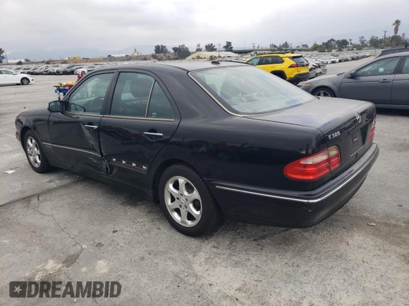 2002 Mercedes-Benz E-Class with VIN WDBJF65J42B486633, listed as a Copart auction lot 76979054 with 151,429 mi miles and Salvage Title. Bid and sale history available at carsss.com. Image 2.