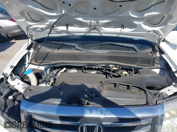 2012 Honda Pilot Touring with VIN 5FNYF3H91CB020673, listed as a IAAI auction lot 41721836 with 123,607 mi miles and . Bid and sale history available at carsss.com. Image 10.