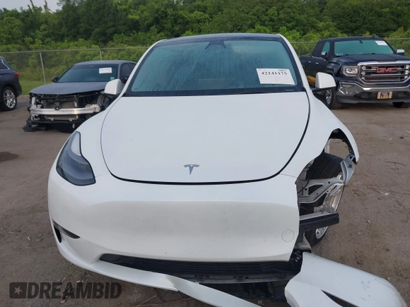 2023 Tesla Model Y Long Range with VIN 7SAYGDEE4PF770307, listed as a IAAI auction lot 42141175 with 34,901 mi miles and . Bid and sale history available at carsss.com. Image 13.
