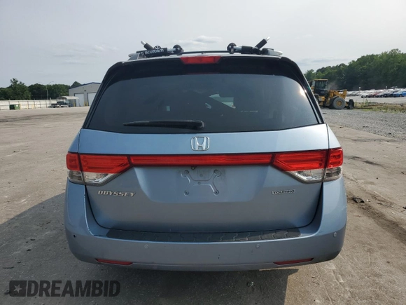 2014 Honda Odyssey Touring with VIN 5FNRL5H95EB080449, listed as a Copart auction lot 58489715 with 154,604 mi miles and Salvage title. Bid and sale history available at DreamBid. Image 6.