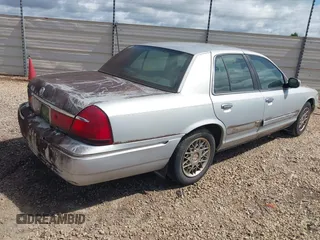 2002 Mercury Grand Marquis GS z VIN 2MEFM74W92X607734, wystawiony jako IAAI lot #42413400 z przebiegiem 209 565 mil mil oraz . Historia ofert i sprzedaży dostępna na DreamBid. Obrazek 4.