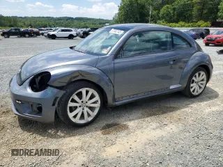 2014 Volkswagen Beetle 1.8T с VIN 3VWJ17AT1EM652372, выставлен на аукционе Copart как лот 61542145 с пробегом 71 158 миль миль и Списание • Salvage title. История ставок и продаж доступна на DreamBid. Изображение 1.