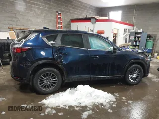 2020 Mazda CX-5 Touring z VIN JM3KFBCM9L0843045, wystawiony jako IAAI lot #41361008 z przebiegiem 76 107 mil mil oraz . Historia ofert i sprzedaży dostępna na DreamBid. Obrazek 13.