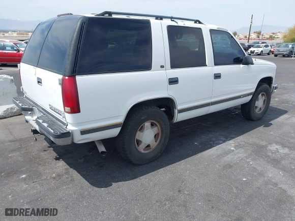 1997 Chevrolet Tahoe with VIN 1GNEK13R6VJ443195, listed as a IAAI auction lot 42000733 with 202,106 mi miles. Bid and sale history available at carsss.com. Image 4.
