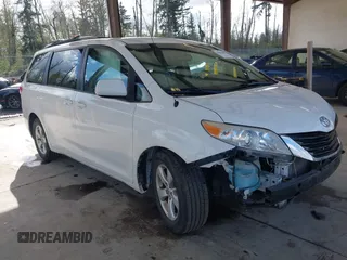 2014 Toyota Sienna LE AAS with VIN 5TDKK3DC4ES505293, listed as a IAAI auction lot 42021409 with 70,319 mi miles. Bid and sale history available at carsss.com. Image 1.