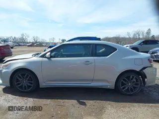 2014 Scion tC with VIN JTKJF5C70E3068144, listed as a IAAI auction lot 41983751 with 137,894 mi miles. Bid and sale history available at carsss.com. Image 14.