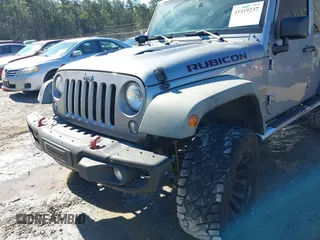 2015 Jeep Wrangler Unlimited Rubicon Hard Rock with VIN 1C4HJWFG2FL587607, listed as a IAAI auction lot 41419237 with 109,719 mi miles and . Bid and sale history available at DreamBid. Image 6.