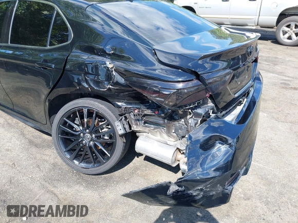 2022 Toyota Camry TRD with VIN 4T1KZ1AK2NU064511, listed as a IAAI auction lot 42176608 with 28,064 mi miles and . Bid and sale history available at DreamBid. Image 6.