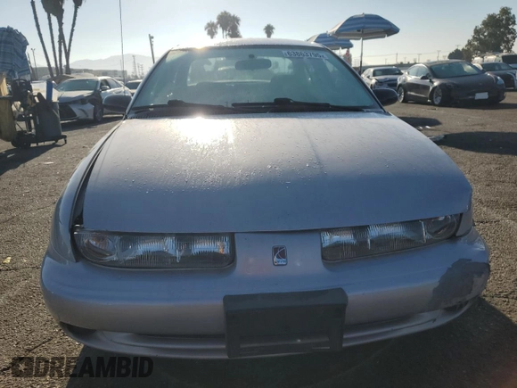 1999 Saturn SL with VIN 1G8ZK5274XZ367394, listed as a Copart auction lot 63863795 with 73,197 mi miles and Salvage title. Bid and sale history available at DreamBid. Image 5.