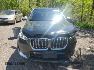 2023 BMW X1 xDrive28i with VIN WBX73EF04P5X86962, listed as a Copart auction lot 57575815 with 95,965 mi miles and Salvage title. Bid and sale history available at DreamBid. Image 5.