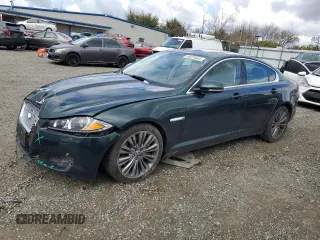 2012 Jaguar XF Portfolio with VIN SAJWA0HB4CLS49225, listed as a Copart auction lot 48070445 with 61,059 mi miles and Salvage Title. Bid and sale history available at carsss.com. Image 1.